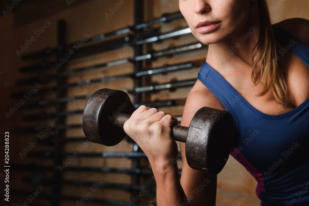 Close up of dumbbell in female hands Close up of dumbbell in female hands