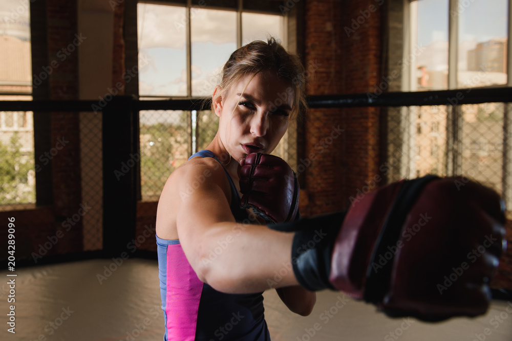 Sexy female boxing in gym