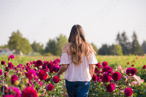 Teen Walking In A Field Of Flowers 