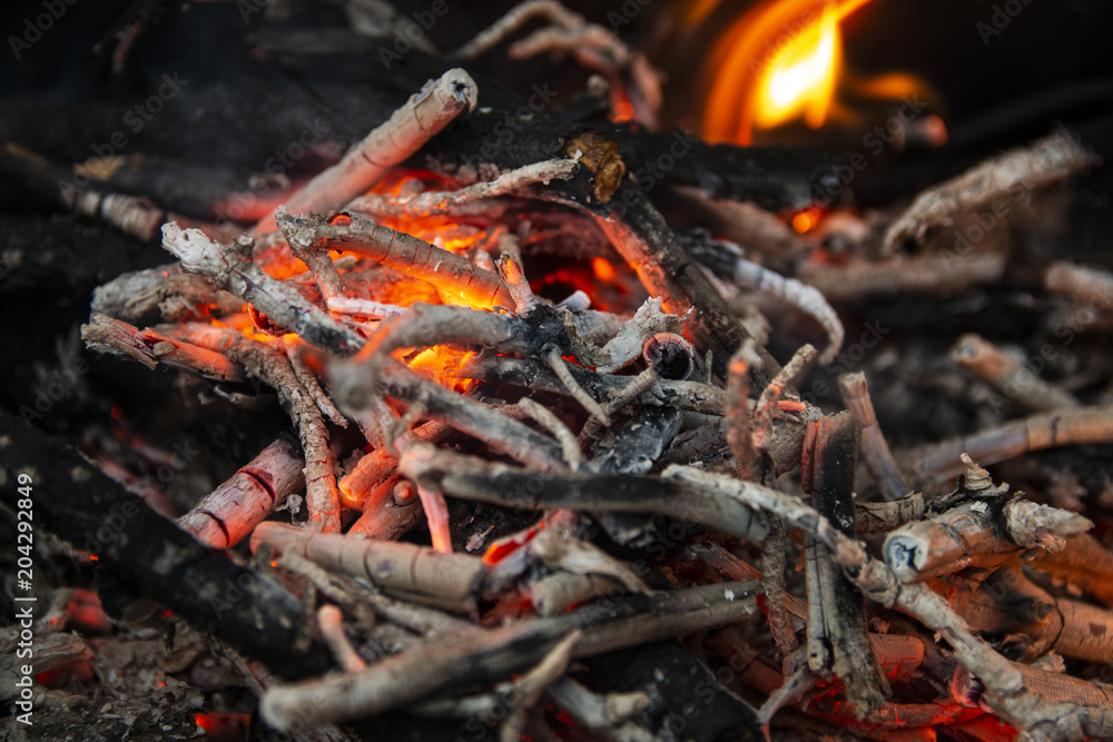 Smoldering ashes from the fire in the grill