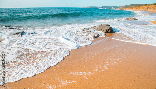 Rock and waves in a sunny day. Sardinia