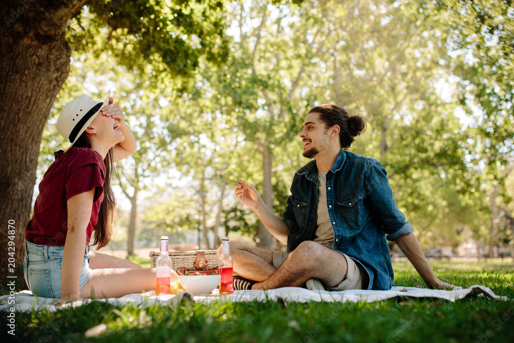 Couple playing games at park Couple playing games at park