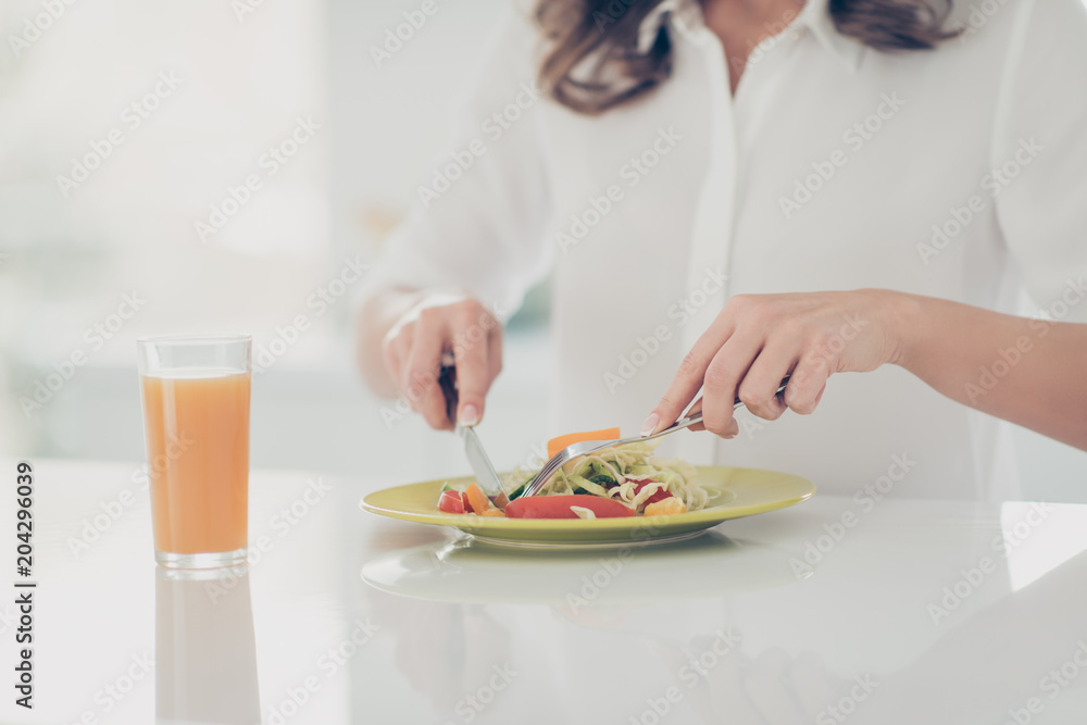 Cropped portrait of woman's hands eating fitness salad from dish with cutlery having fresh drink eating healthy cuisine keeping weight loss program, cook, cookery concept Cropped portrait of woman's hands eating fitness salad from dish with cutlery having fresh drink eating healthy cuisine keeping weight loss program, cook, cookery concept