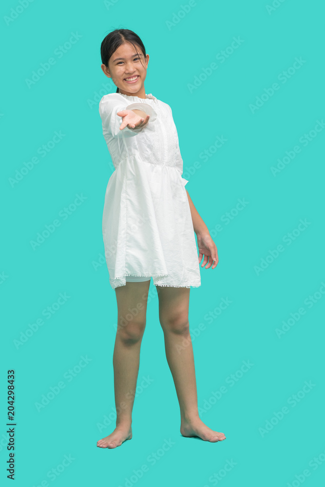 Portrait of teenage girl holding opened palms in front of herself and looking at camera, over green background Portrait of teenage girl holding opened palms in front of herself and looking at camera, over green background