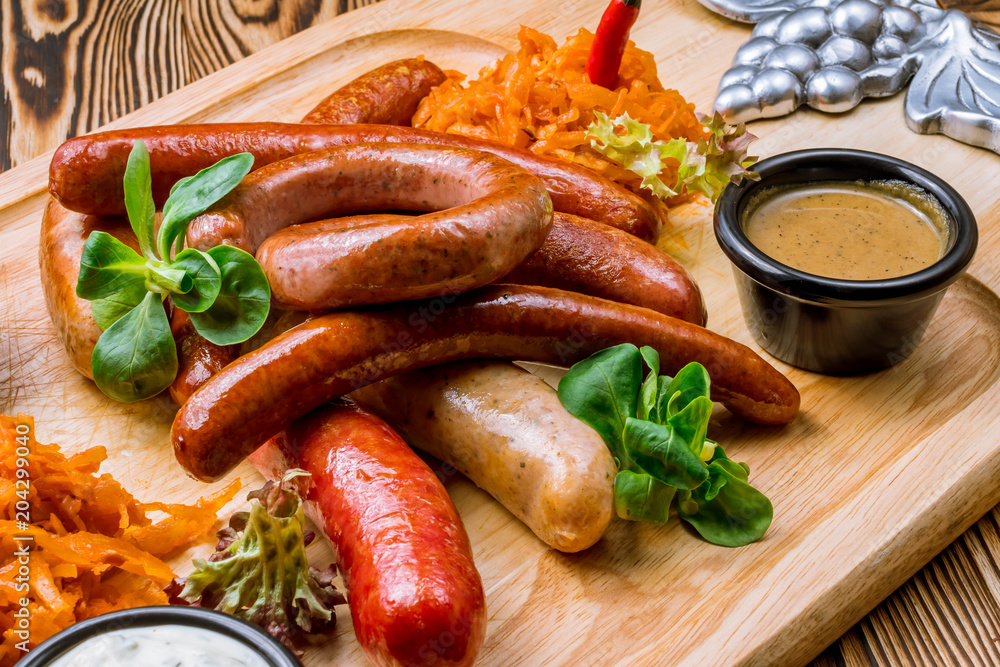 assorted sausages with sauces