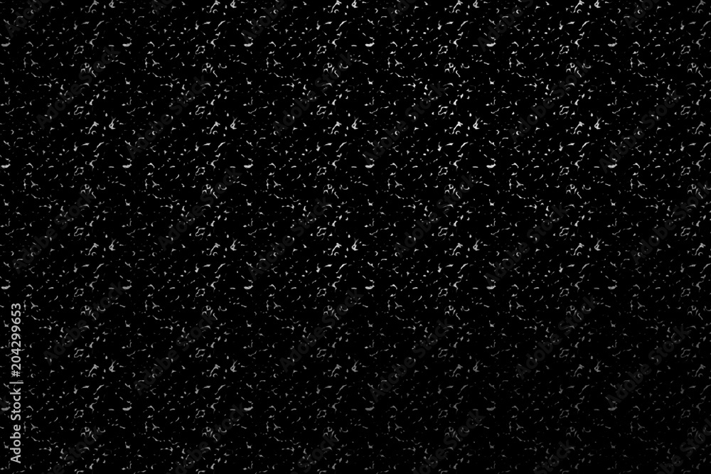 Digital grunge texture on a black background. Grainy black and white seamless pattern. Design element.