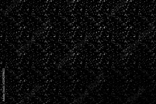 Digital grunge texture on a black background. Grainy black and white seamless pattern. Design element.