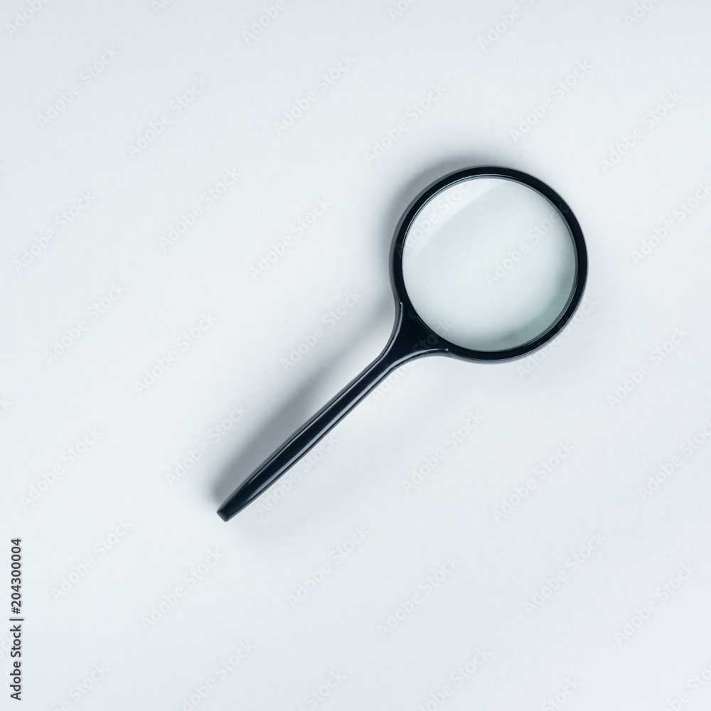closeup shot of magnifier on gray background closeup shot of magnifier on gray background