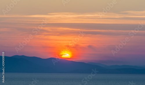 Fototapeta Naklejka Na Ścianę i Meble -  beautiful fiery sunset over the sea