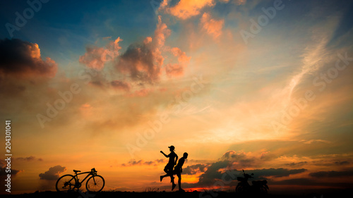 silhouette of boys jumping during sunset time.