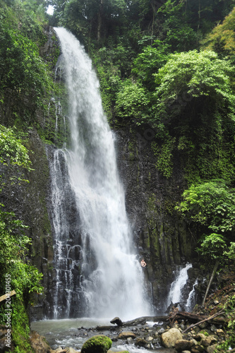 A man meditates next to Catarata Zamora, the first of the two waterfalls in the protected jungle of the Los Chorros Park in Costa Rica. 