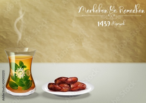 Marhaban ya Ramadhan. Iftar party celebration with traditional tea cup and a bowl of dates