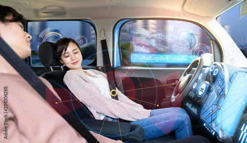 Quadro em tela Young woman sleeping in autonomous car.