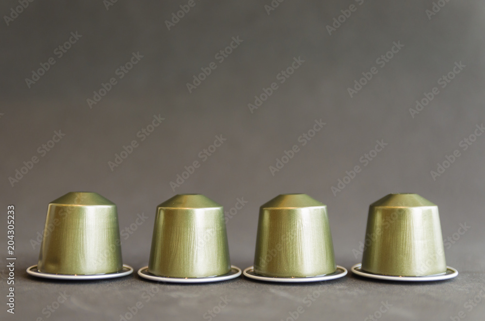 Beautiful colored coffee capsules on black background Beautiful colored coffee capsules on black background