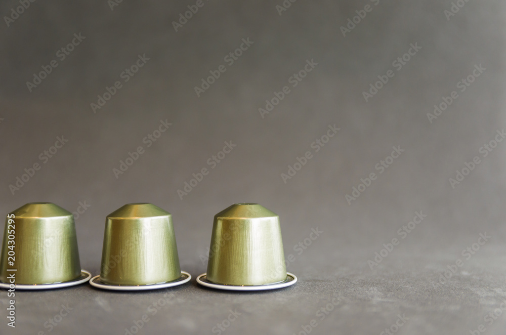 Beautiful colored coffee capsules on black background Beautiful colored coffee capsules on black background