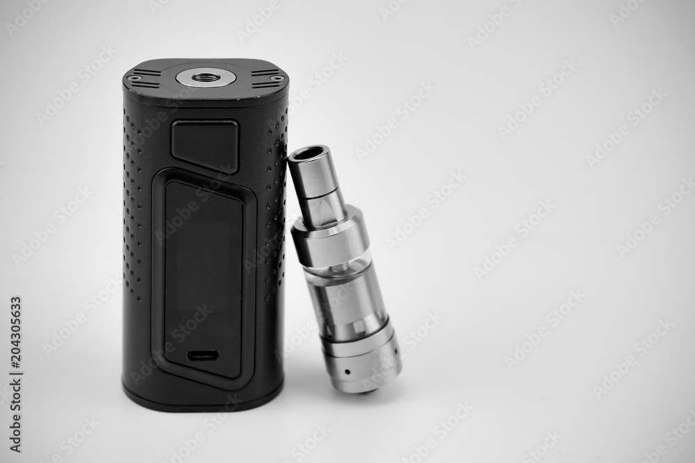 E - cigarette for vaping , technical devices.The liquid in the bottle E - cigarette for vaping , technical devices.The liquid in the bottle