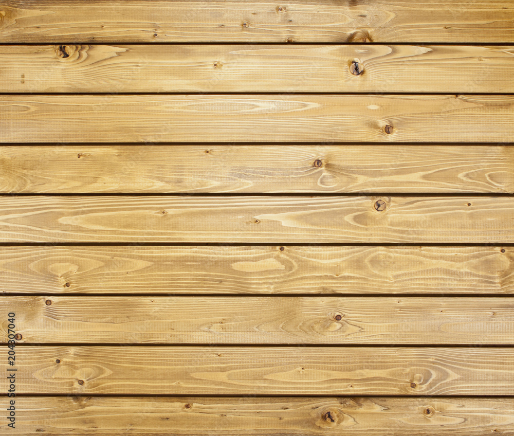 Fototapeta premium Wooden wall with horizontal planks. Close up of an old wooden fence panels.