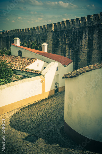 Beautiful narrow streets in the medieval town of Obidos. Portugal. Vintage style