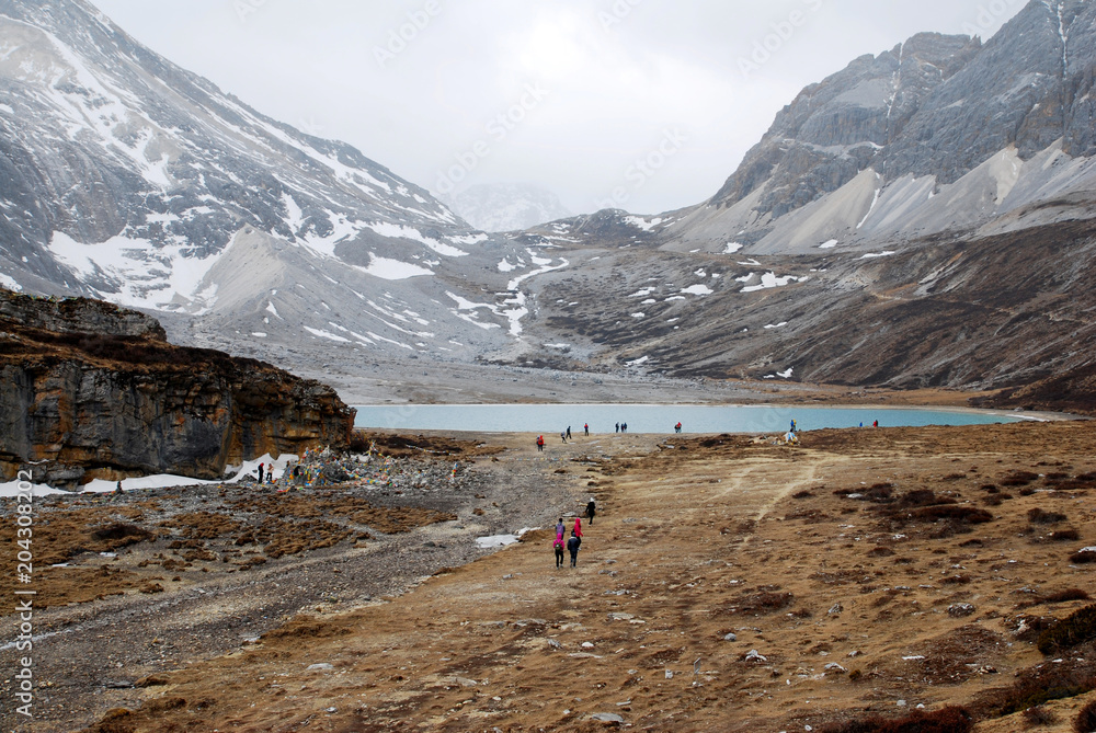 Milk Lake yading landscape at Yading national reserve.It is Beautiful lake color like a milk blue.Daocheng County,Sichuan Province, China - Nature trek and hike travel Milk Lake yading landscape at Yading national reserve.It is Beautiful lake color like a milk blue.Daocheng County,Sichuan Province, China - Nature trek and hike travel