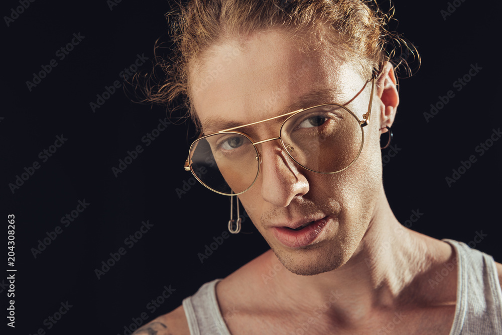 elegant man in fashionable stylish glasses, isolated on black elegant man in fashionable stylish glasses, isolated on black