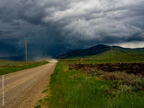 approaching montana storm on a country road