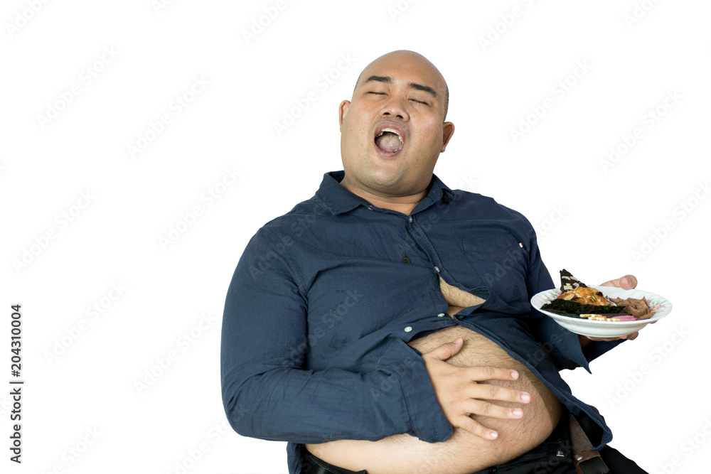 fat man eating, portrait of overweight person feels hungry and eating chips,cake,green tea frappe seated on armchai, isolated on white background with clipping path fat man eating, portrait of overweight person feels hungry and eating chips,cake,green tea frappe seated on armchai, isolated on white background with clipping path