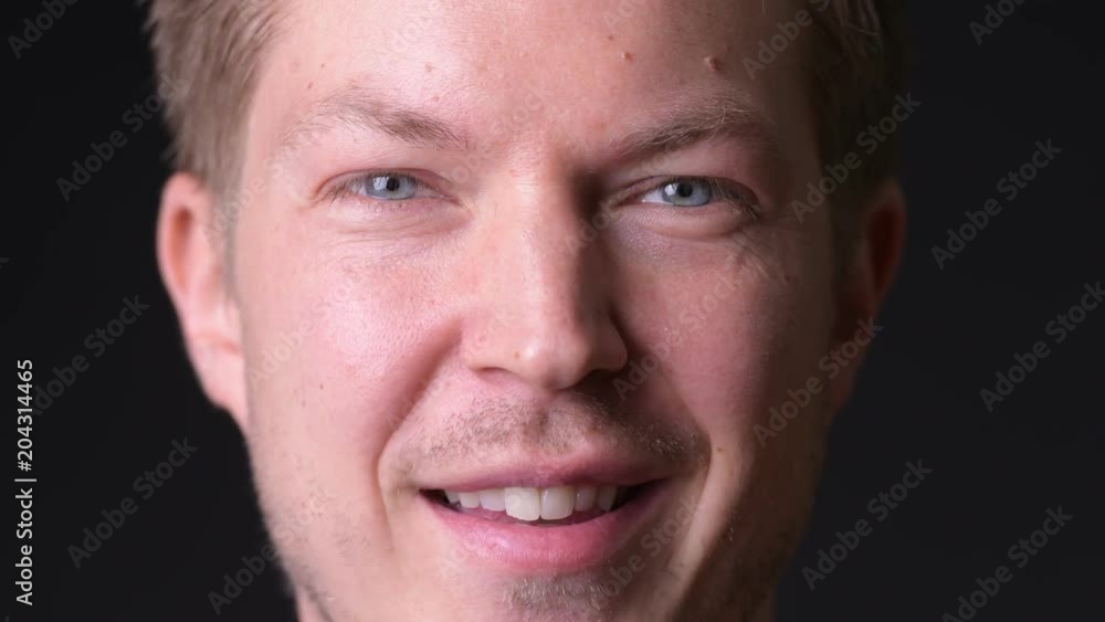 Young man against black background Young man against black background