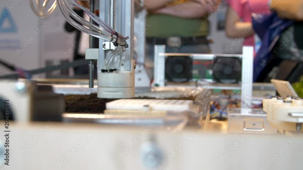 The production robots planting seeds in the soil at a modern technology exhibition and robotics in Russia. The production robots planting seeds in the soil at a modern technology exhibition and robotics in Russia.