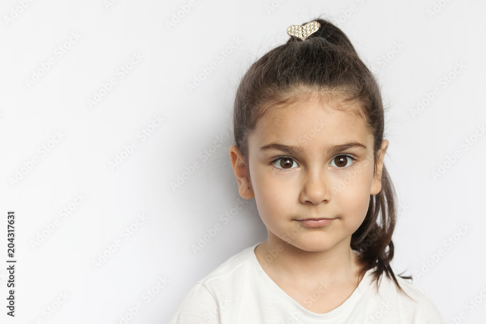 Portrait of little cute serious child girl Portrait of little cute serious child girl