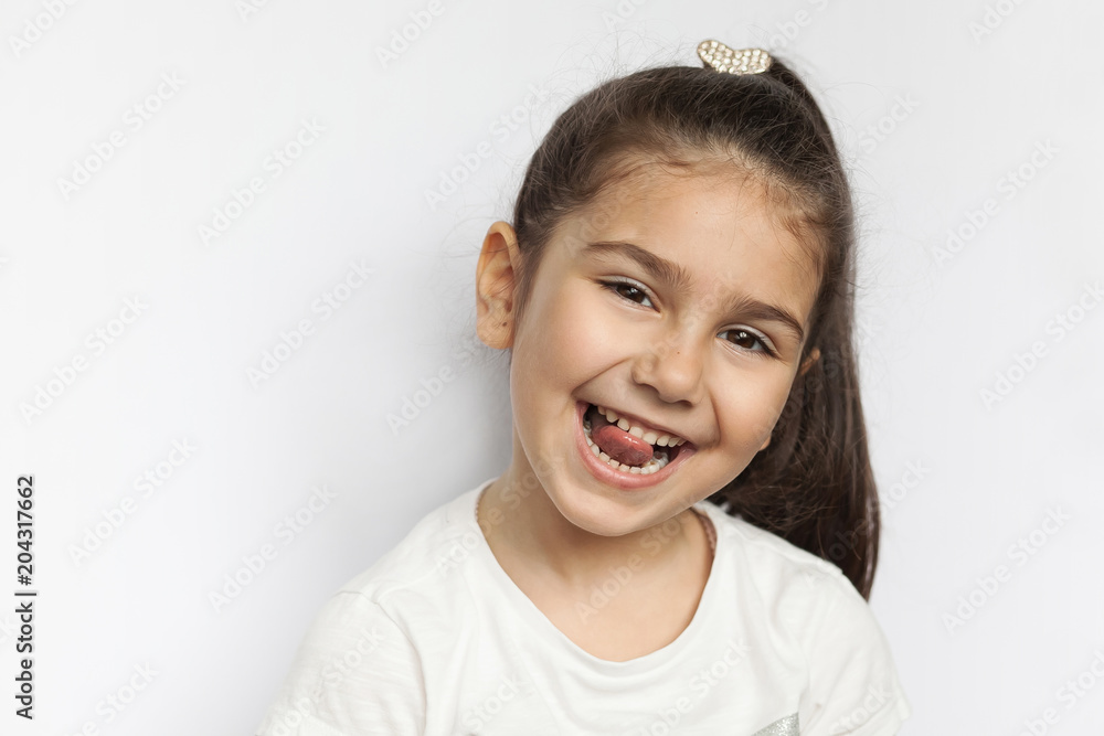 Portrait of a happy laughing child girl Portrait of a happy laughing child girl