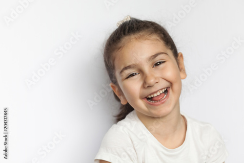 Portrait of a happy smiling child girl
