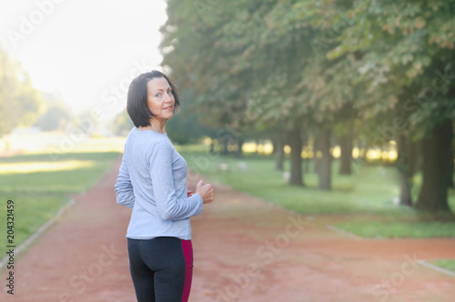 Portrait of mature woman before or after jog in the park