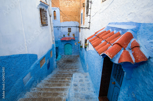 Small rustic staircase street in Chefchaouen, the Blue city, in Morocco © Marko Rupena