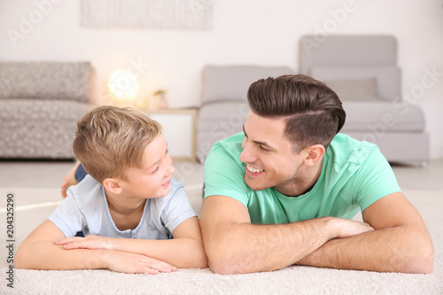 Young man and little boy in...