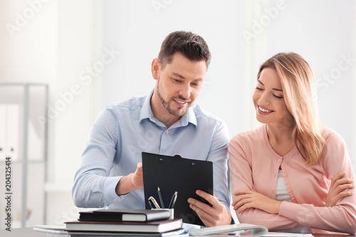 Businessman consulting youn...