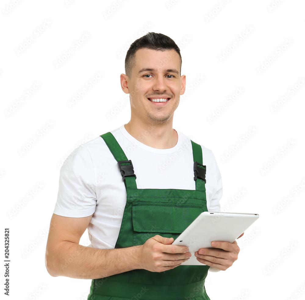 Young plumber with tablet computer on white background Young plumber with tablet computer on white background