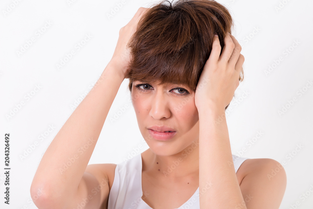 Health and pain. Stressed exhausted young woman having strong tension headache. Isolated on white background. Studio lighting. Concept for healthy and medical Health and pain. Stressed exhausted young woman having strong tension headache. Isolated on white background. Studio lighting. Concept for healthy and medical