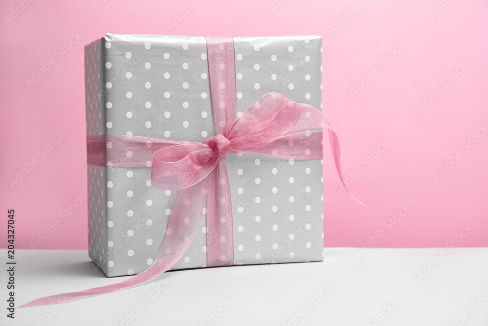 Elegant gift box for Mother's Day on table Elegant gift box for Mother's Day on table
