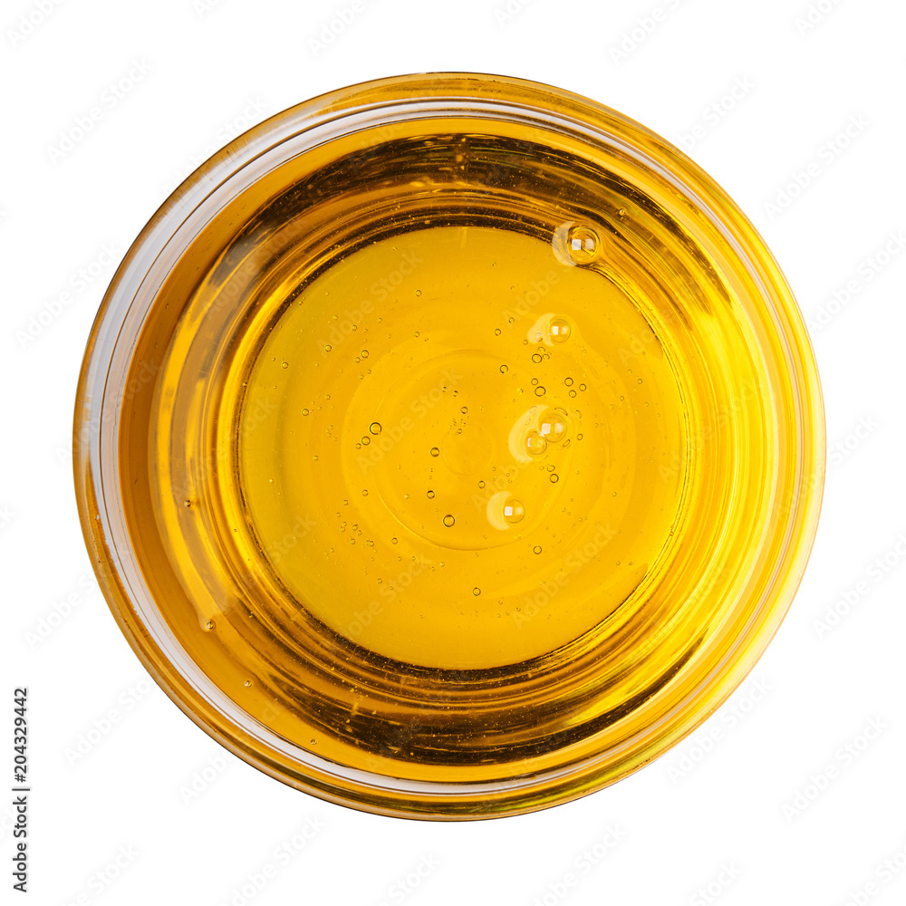 Glass bowl oil of vegetable olive isolated on white background top view object cooking kitchen design Glass bowl oil of vegetable olive isolated on white background top view object cooking kitchen design