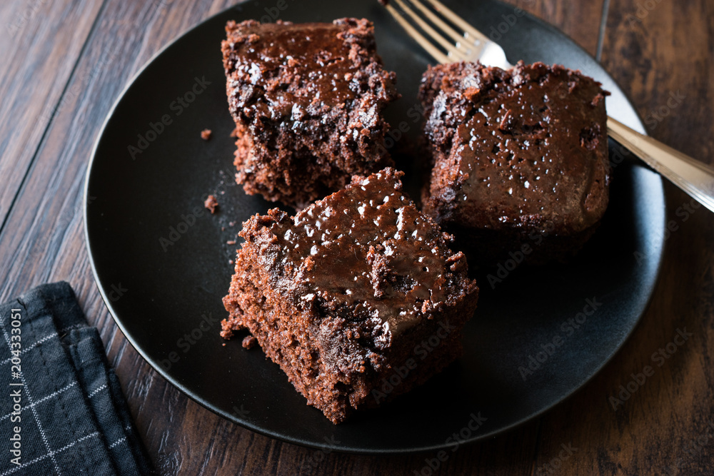 Moist Chocolate Sponge Cake Brownie Pieces in Black Plate Moist Chocolate Sponge Cake Brownie Pieces in Black Plate