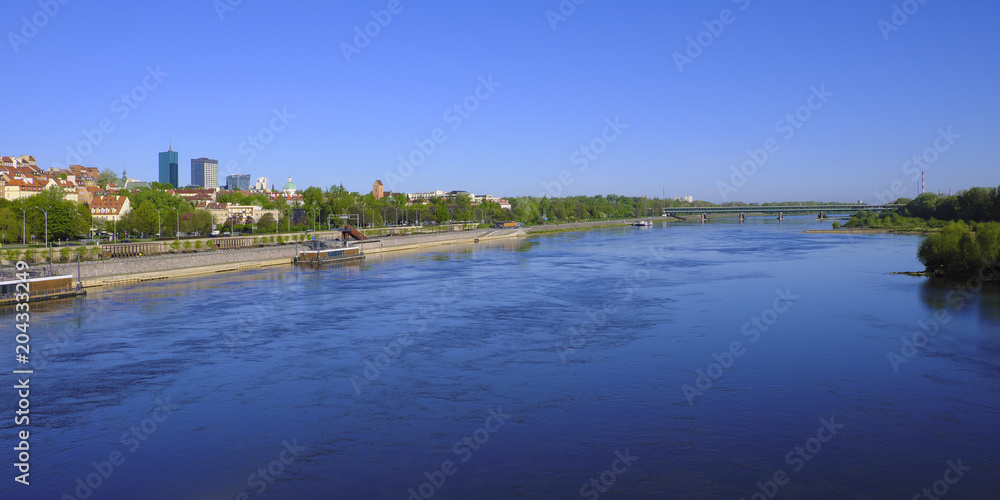 Warsaw, Poland - Panoramic view of historic quarter of Warsaw with old town tenements and north districts seen from the Vistula river side