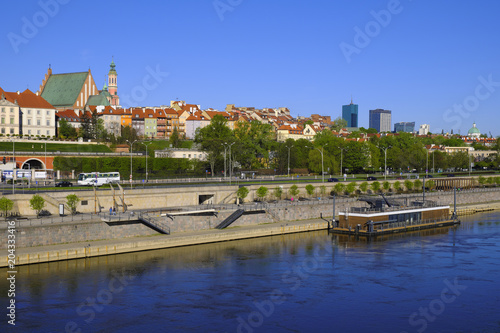 Warsaw, Poland - Panoramic view of historic quarter of Warsaw with Royal Castle and old town tenements seen from the Vistula river side