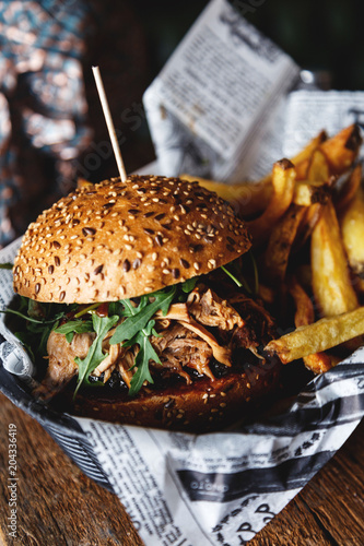 Close-up of burger with french fries in a basket