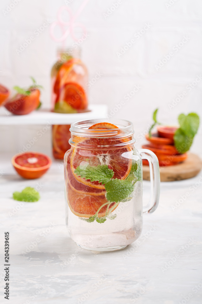 Detox infused water flavored with bloody orange and mint. Healthy refreshing beverage. Detox infused water flavored with bloody orange and mint. Healthy refreshing beverage.