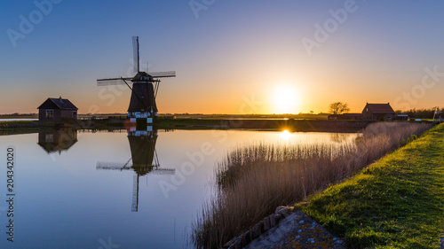 Dutch windmill Het Noorden during Sunset on the island Texel in the Netherlands
