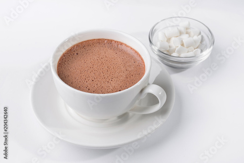 White coffee cup with dessert marshmallow