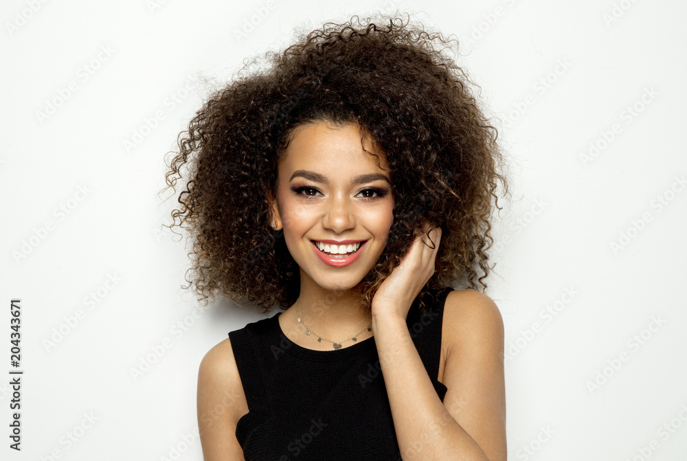 Portrait of young beautiful black woman smiling isolated on white Stock ...