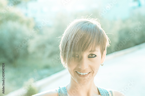 Picture of a girl with short hair outdoors