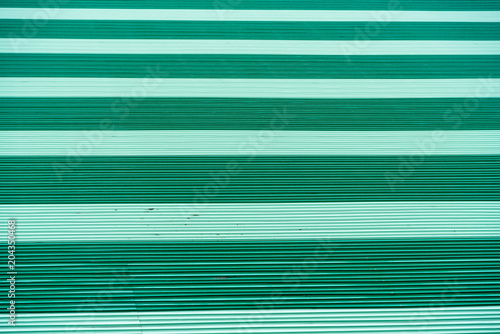 Seamless abstract background green with horizontal lines of the roof.