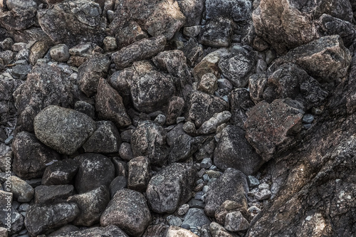 Closeup of black coal lumps. Heap of dark stones. Close up stone texture, Crushed stone, railway ballast, gray patttern background, high resolution seamless texture, concrete, uneven cement